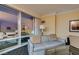 Comfortable living area with a couch, glass coffee table and great views from the large window at 2000 Fashion Show Dr # 5509, Las Vegas, NV 89109