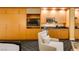 The suite offers a mini-kitchen with stainless appliances, cabinets, TV and an upholstered club chair at 2000 Fashion Show Dr # 5509, Las Vegas, NV 89109