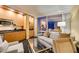 Inviting living room area featuring a sofa, armchair, and kitchenette, ideal for relaxation at 2000 Fashion Show Dr # 5509, Las Vegas, NV 89109