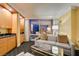 Cozy living room featuring a comfortable sofa, kitchenette, and a large window with city views at 2000 Fashion Show Dr # 5509, Las Vegas, NV 89109