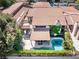 Aerial view of a home with a private pool, balcony, and lush landscaping at 2017 Plaza De Cielo, Las Vegas, NV 89102