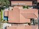 Aerial view of a home with a pool, patio, and lush landscaping with a tiled roof at 2017 Plaza De Cielo, Las Vegas, NV 89102