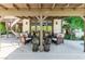 Spacious backyard area offers mature landscaping, a spiral staircase, a covered patio, and comfortable outdoor seating at 2017 Plaza De Cielo, Las Vegas, NV 89102