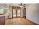 Bright dining area featuring wood floors, ornate door, and access to the backyard at 2017 Plaza De Cielo, Las Vegas, NV 89102