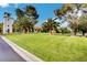 Lush green lawns with palm trees and community buildings in the background at 2017 Plaza De Cielo, Las Vegas, NV 89102
