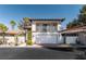 Charming two-story home with a balcony, tile roof, and gated entry for added curb appeal at 2017 Plaza De Cielo, Las Vegas, NV 89102