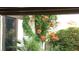 Nice exterior view of a house with beautiful flowering vines and a garden at 2017 Plaza De Cielo, Las Vegas, NV 89102