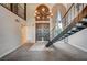 Elegant foyer featuring a staircase, chandelier, and double front doors, creating a grand entrance at 2017 Plaza De Cielo, Las Vegas, NV 89102