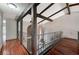 Elegant foyer featuring wood floors, exposed beams, iron railings, and a decorative chandelier at 2017 Plaza De Cielo, Las Vegas, NV 89102