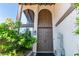 Grand front entrance showcasing a double door, large windows, and mature landscaping at 2017 Plaza De Cielo, Las Vegas, NV 89102