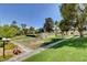 Beautifully maintained green grounds with trees and walkways on a sunny day at 2017 Plaza De Cielo, Las Vegas, NV 89102