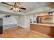 Open kitchen with breakfast bar, stainless appliances, and wood floors at 2017 Plaza De Cielo, Las Vegas, NV 89102