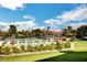 Community pool with lounge chairs and umbrellas with the city skyline in the background at 2017 Plaza De Cielo, Las Vegas, NV 89102