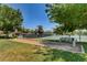 Community tennis courts featuring well-maintained courts and a comfortable bench for relaxation at 2017 Plaza De Cielo, Las Vegas, NV 89102