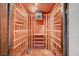 Custom wine cellar with wooden racking and cooling system for storing wine bottles at 2017 Plaza De Cielo, Las Vegas, NV 89102