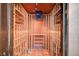 Custom wine cellar with wooden racking and cooling system for storing wine bottles at 2017 Plaza De Cielo, Las Vegas, NV 89102