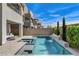 Backyard view with a pool, spa, outdoor seating, and landscaping; perfect for relaxation and entertainment at 2115 Noble Perch St, Las Vegas, NV 89138