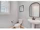 This is a well-lit bathroom with neutral walls, a decorative mirror, and modern fixtures at 2115 Noble Perch St, Las Vegas, NV 89138