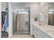 Modern bathroom featuring double vanity, frameless glass shower, and walk-in closet at 2115 Noble Perch St, Las Vegas, NV 89138
