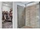 Contemporary bathroom showcasing tiled walk-in shower and open walk-in closet at 2115 Noble Perch St, Las Vegas, NV 89138