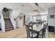 Open dining area and kitchen, with modern light fixture at 2115 Noble Perch St, Las Vegas, NV 89138