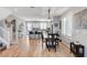 Dining area with stairs and view into a white kitchen at 2115 Noble Perch St, Las Vegas, NV 89138