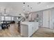 Open concept kitchen view highlights a large island with barstool seating, modern lighting, and open sightlines at 2115 Noble Perch St, Las Vegas, NV 89138