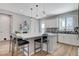 Bright kitchen with pendant lights over a large island with seating, and modern appliances at 2115 Noble Perch St, Las Vegas, NV 89138