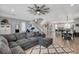 Open-concept living room, dining area, and kitchen with modern decor at 2115 Noble Perch St, Las Vegas, NV 89138