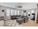 Cozy living room with a large sectional sofa and a stylish area rug at 2115 Noble Perch St, Las Vegas, NV 89138