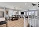 The open concept living room features wood floors, recessed lighting, and stairs leading to the upper level at 2115 Noble Perch St, Las Vegas, NV 89138