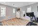 Light-filled room with a mirror and white shelving unit with decorative items at 2115 Noble Perch St, Las Vegas, NV 89138