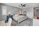 Main bedroom showcasing a ceiling fan, plush carpet, shutters, and neutral paint at 2115 Noble Perch St, Las Vegas, NV 89138