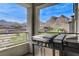 Outdoor patio featuring a grill, overlooking mountain views and nearby construction at 2115 Noble Perch St, Las Vegas, NV 89138
