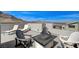 Stylish rooftop deck equipped with lounge chairs and a fire pit, complemented by scenic mountain backdrop at 2115 Noble Perch St, Las Vegas, NV 89138