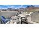 Expansive rooftop deck with varied seating options and mountain views for social gatherings at 2115 Noble Perch St, Las Vegas, NV 89138