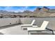Scenic rooftop deck offering breathtaking views of mountains and nearby neighborhood homes at 2115 Noble Perch St, Las Vegas, NV 89138