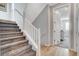Carpeted staircase with neutral walls leads to upstairs bedrooms at 2115 Noble Perch St, Las Vegas, NV 89138