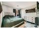 Comfortable bedroom with modern furniture, neutral walls, and ample closet space at 2301 Cambridge Elms St, North Las Vegas, NV 89032