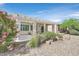 Backyard featuring a covered patio with desert landscaping and plants at 2525 Willow Wren Dr, North Las Vegas, NV 89084