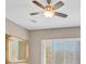 Neutral-toned bedroom with a ceiling fan, shuttered window, and carpeted floors at 2525 Willow Wren Dr, North Las Vegas, NV 89084