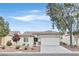 Charming single-story home featuring a two-car garage, desert landscaping, and a welcoming entrance at 2525 Willow Wren Dr, North Las Vegas, NV 89084