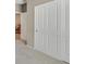 This hallway leads past the coat closet to the piano room at 2525 Willow Wren Dr, North Las Vegas, NV 89084