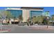 View of the 'Aliante Casino + Hotel' building with many floors and windows and a parking area in front at 2525 Willow Wren Dr, North Las Vegas, NV 89084