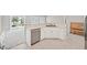 This kitchen features white cabinetry and a stainless steel dishwasher for modern convenience at 2525 Willow Wren Dr, North Las Vegas, NV 89084