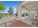 Covered patio with desert landscaping, a golf course view, and patio furniture at 2525 Willow Wren Dr, North Las Vegas, NV 89084