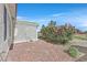 Desert landscape features flowering bushes, gravel, and a low wall at 2525 Willow Wren Dr, North Las Vegas, NV 89084