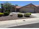 Charming single-story home featuring a well-maintained front yard with mature landscaping and a two-car garage at 2708 Hope Forest Dr, Las Vegas, NV 89134