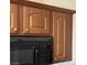 Close-up of the kitchen with cabinets and black microwave at 2708 Hope Forest Dr, Las Vegas, NV 89134