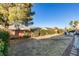 Spacious backyard featuring a patio area, well-maintained landscaping, and privacy fence at 2712 Peekskill Ave, Henderson, NV 89052